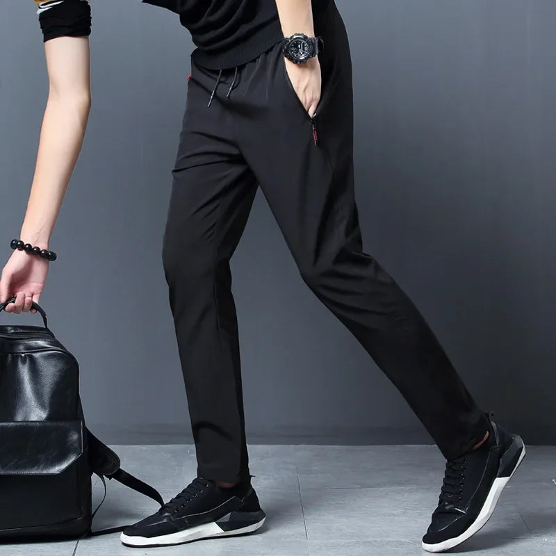 Calças casuais masculinas elásticas slim fit, calças de corrida com cintura elástica, estilo coreano, azul, preto, cinza, calças masculinas de marca plus size