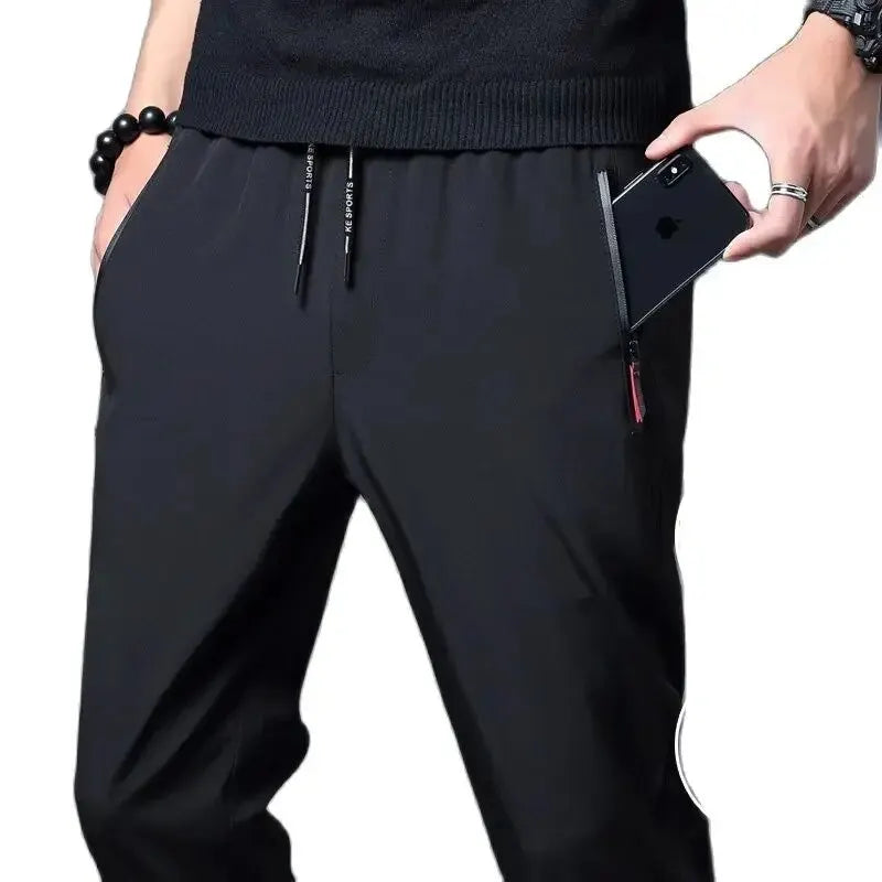Calças casuais masculinas elásticas slim fit, calças de corrida com cintura elástica, estilo coreano, azul, preto, cinza, calças masculinas de marca plus size