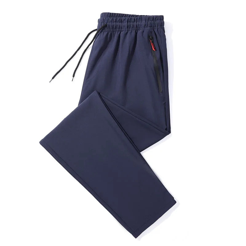 Calças casuais masculinas elásticas slim fit, calças de corrida com cintura elástica, estilo coreano, azul, preto, cinza, calças masculinas de marca plus size