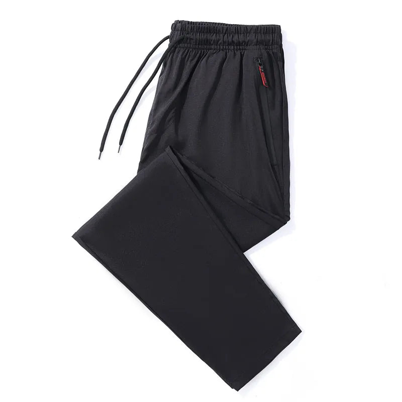 Calças casuais masculinas elásticas slim fit, calças de corrida com cintura elástica, estilo coreano, azul, preto, cinza, calças masculinas de marca plus size